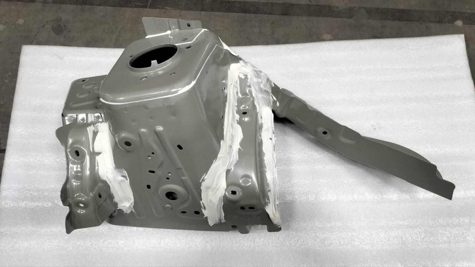 Left front wheel housing assembly