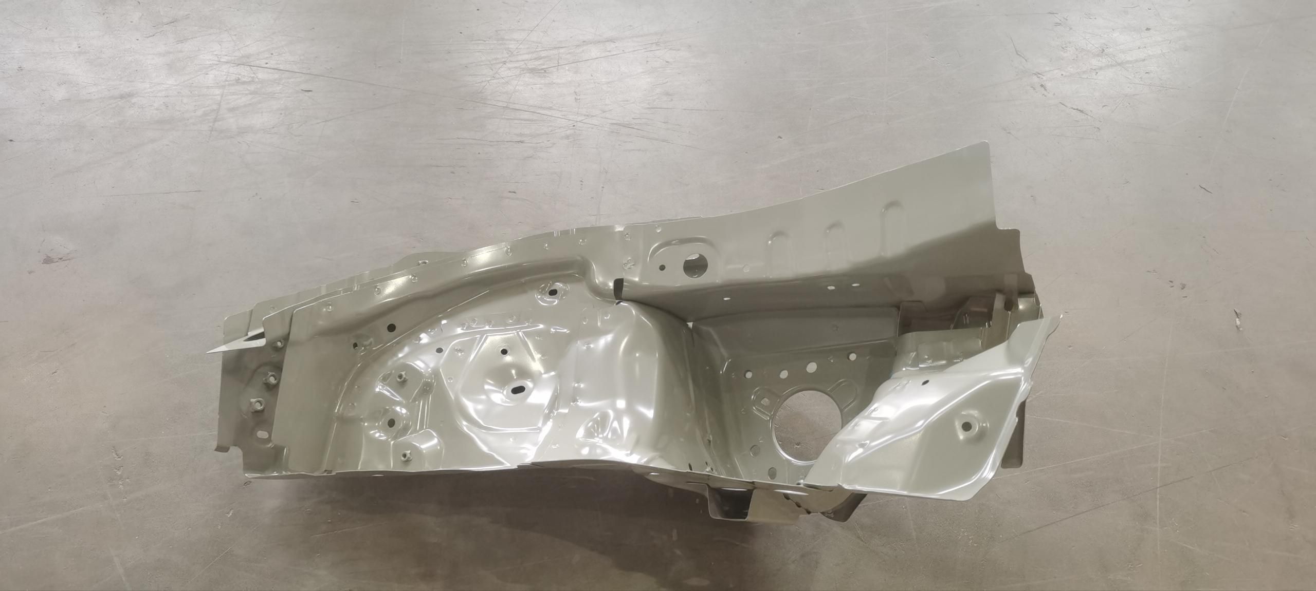 Left front wheel housing assembly