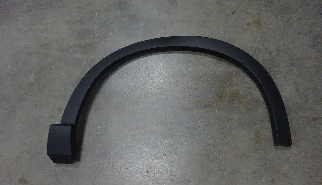 Right front wheel eyebrow trim panel assembly