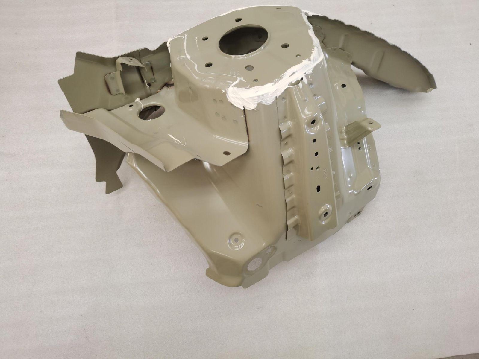 Left front wheel housing assembly