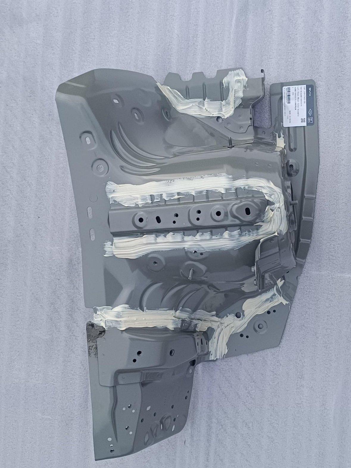 Left front wheel housing assembly