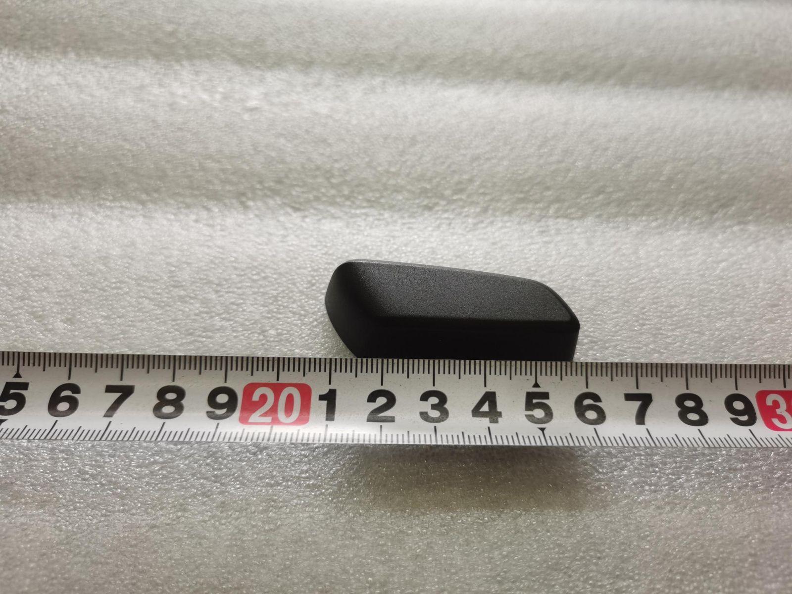 Front passenger seat cushion adjustment button