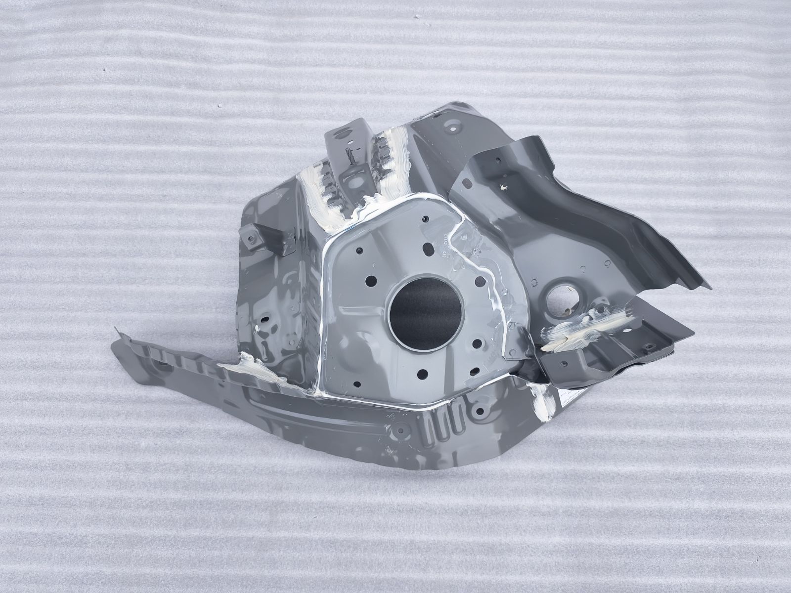 Left front wheel housing assembly