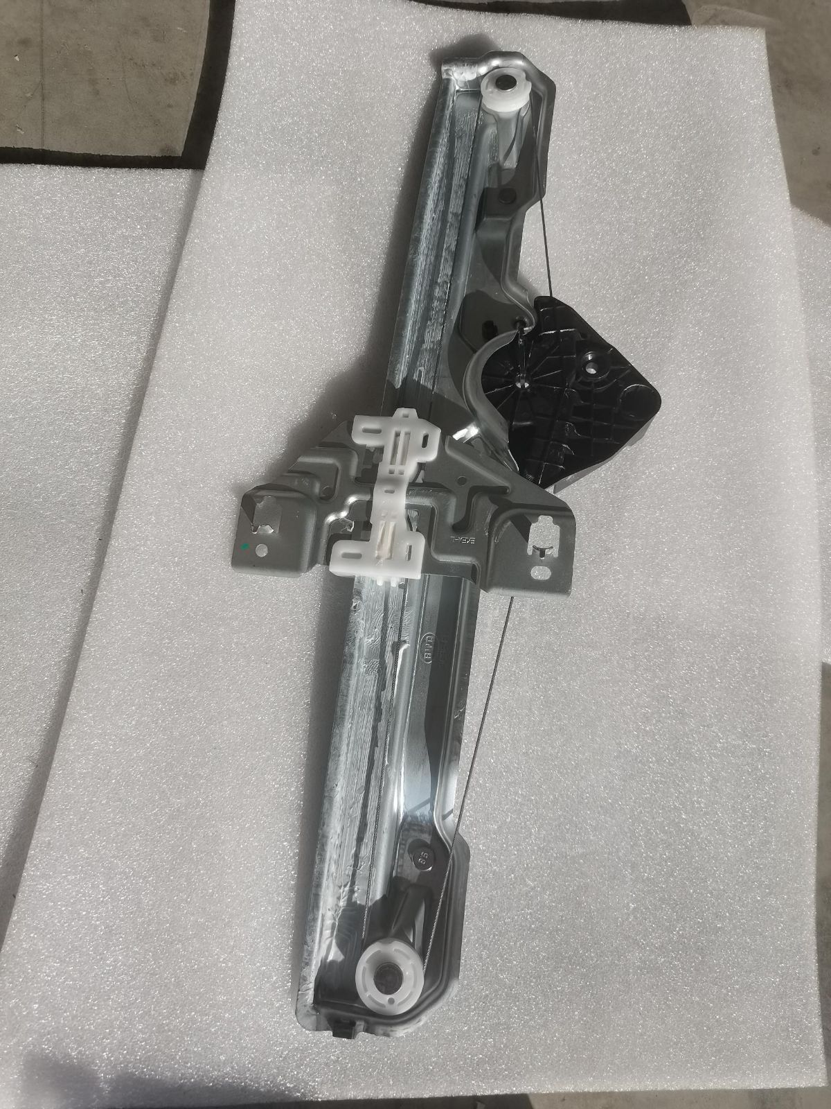 Left front door guide rail assembly component