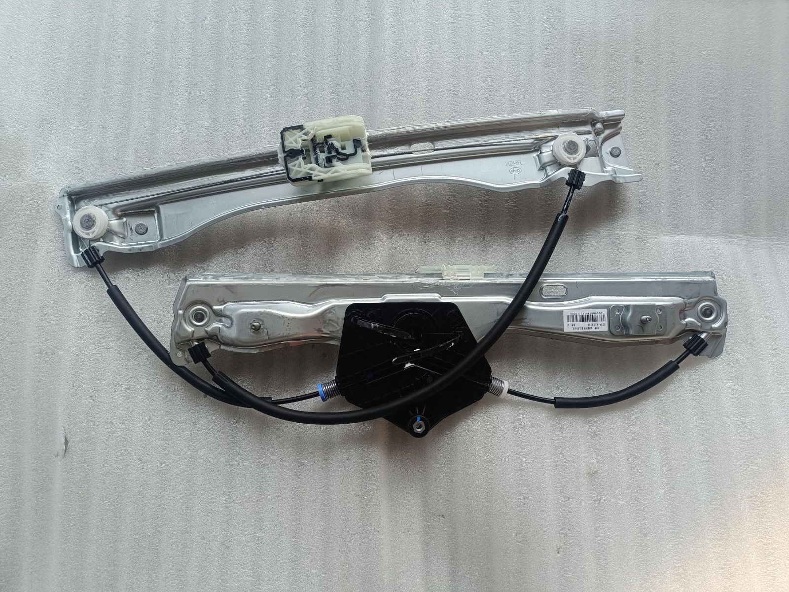 Left front door window regulator bracket assembly